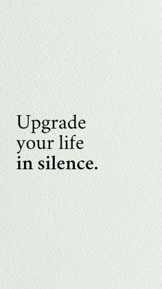 the words upgrade your life in silence are written on a white paper with black lettering