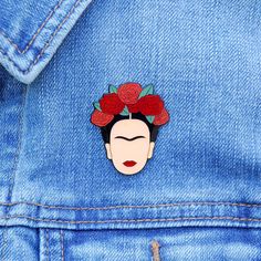 a woman with flowers in her hair is wearing a blue jean jacket and has red roses on her head