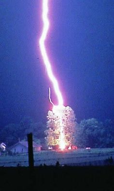 a lightning bolt hitting through the night sky