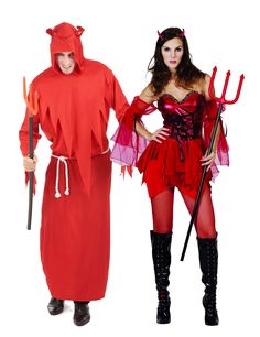 two people dressed in devil and devil costume standing next to each other, one holding a pitchfork