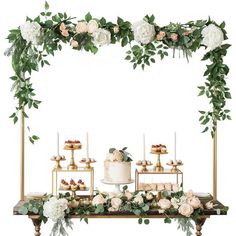 a table topped with a cake and lots of flowers