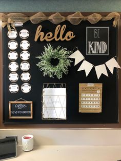 a black board with white and gold decorations on it that says hello, be kind