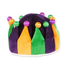 a purple and green hat with colorful beads on it's sides, sitting in front of a white background