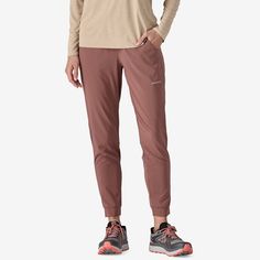 Add a pair of lightweight performance pants to your trail kit with the Terrebonne Joggers: light, breathable, quick-drying and stretchy, with a comfortable waistband and cuffs, and a durable water repellent (DWR) finish made without perfluorinated chemicals (PFCs/PFAS). They’re perfect for any activity on the trail. Inseam length is 28. Made in a Fair Trade Certified™ factory. | Patagonia Women's Terrebonne Lightweight Performance Joggers in Dulse Mauve, Small - Trail Running Pants & Tights - Re Casual Green Patagonia Bottoms, Patagonia Women's Sports Bottoms, Patagonia Midweight Bottoms With Pockets, Nylon Hiking Pants Midweight, Patagonia Moisture-wicking Bottoms For Hiking, 50% Logo, Running Pants, Utility Pants, Patagonia Womens