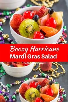 two white bowls filled with fruit on top of a black table next to mardi gras beads