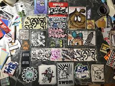 various stickers and decals on the back of a skateboarder's wall