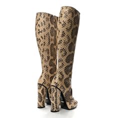 This is an authentic GUCCI Snakeskin Lilian Horsebit Knee High Boots size 36 in Taffy. These tall boots are crafted of snakeskin in brown and beige. These boots feature a covered heel, Gucci silver horsebit on the front, and a squared toe. Brown And Beige, Taffy, Tall Boots, High Boots, Knee High Boots, Snake Skin, Knee High, Gucci, Heels