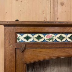 a close up of a wooden shelf with tile on it