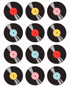 an image of vinyl records with different colors and sizes on them, all arranged in the same pattern