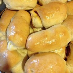 a pile of bread rolls sitting next to each other