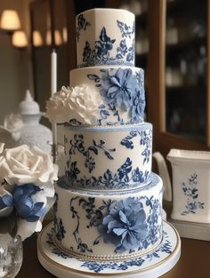 a blue and white cake sitting on top of a table