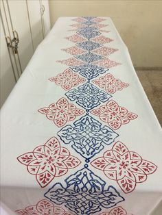 a long table with red, white and blue designs on it