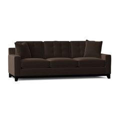 a brown couch sitting on top of a white floor