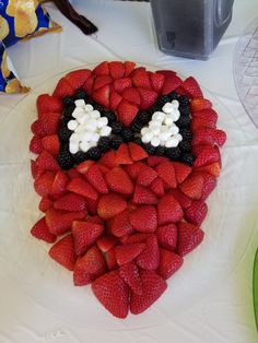 a cake made to look like a face with strawberries on it