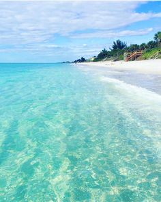 the water is crystal blue and clear on this beach