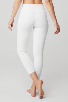 The 7/8 High-Waist Airbrush Legging — all the smoothing, sculpting benefits of the full-length version, in a perfectly cropped package. So good for studio & all-day cool for street, this look features flat-locked seaming for comfort and functionality, no side seams, and an on-trend high waist. Sculpts, lifts & smooths! No side seams & flat-locked seams for extra comfort Designed & uniquely fit to flatter every size Wear-tested by our in-house team for the perfect fit Alo Yoga® | 7/8 High-Waist A Alo White Leggings, White Yoga Pants, White Pants Women, Perfect Leggings, Stretchy Leggings, White Leggings, Womens Capris, Womens Wellness, It Girl