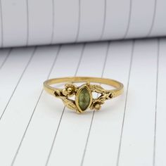 Product:-Ring Material:- Brass Size:- All size available Gemstone:- Peridot    Peridot Leaf Ring, Gold Ring, Wedding Ring ,Flower Ring, Stacking Ring,Marquise Cut Ring ,Peridot Ring,Boho Ring ,Minimal Ring,Promise Ring, ❥ Customers' satisfaction is our biggest priority, please contact us with any questions/queries for future or existing orders, and we will do our best to make sure you are happy with your order. ❥Please make sure to add the correct address during checkout. You can return your purchased item within 15 days after successful delivery. We offer a 100% "Money Back Guarantee" if you are not satisfied with your purchase. ❥If you are not satisfied with your purchased items then contact with us first before leaving negative or neutral feedback or opening disputes. We believe in solv Gold Frog Ring, Peridot And Opal Ring, Mushroom Engagement Ring, Bohemian Gold Rings With Birthstone, Handmade Green Brass Rings, Bohemian Green Flower Ring For Gift, Bohemian Green Birthstone Ring, Bohemian Green Rings For Anniversary, Bohemian Green Toe Rings