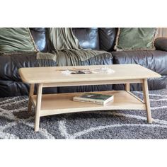 a coffee table sitting on top of a rug