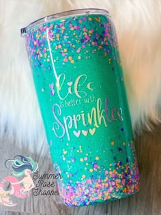 a green glitter tumbler with the words life is better with sprinkles on it