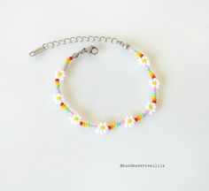 Rainbow daisy chain bracelet 🌼 ✨MATERIALS * Stainless steel clasp * Glass seed beads ✨ SIZE * Adjustable of 16.5cm + extension chain 6cm * Flower size = 6mm 💛 Visit my store for more handmade jewelry : handmadebyemilija.etsy.com 🌸 Instagram: @handmadebyemilija Rainbow Daisy, Bracelet Materials, Daisy Bracelet, Seed Bead Bracelet, Handmade Beaded Jewelry, Bracelet Beaded, Daisy Chain, Bracelets Handmade Beaded, Jewelry Boho