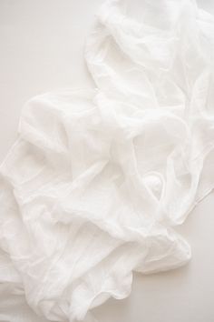 a white sheet laying on top of a table