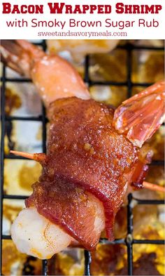 bacon wrapped shrimp with smoky brown sugar rubs on a bbq grill in the background