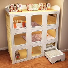 a doll house with lots of shelves and drawers