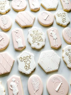 wedding cookies are arranged in rows on a table