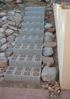 the steps are made out of cinder blocks and bricks, along with gravel in between them