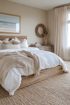 a bedroom with a large bed and beige carpeted flooring in front of a window