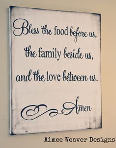 a sign that says, be the food before us, the family beside us, and the love between us