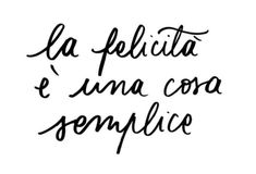 the words la felicita e una consplice written in cursive writing