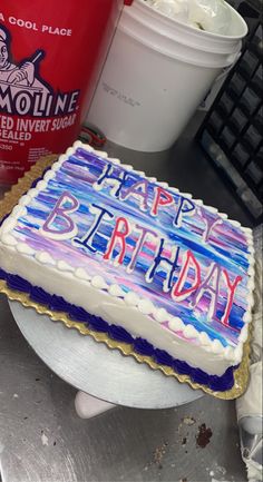 a birthday cake with the words happy birthday written on it