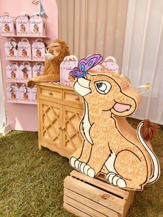 a wooden cutout of a dog sitting on top of a dresser next to a stuffed animal