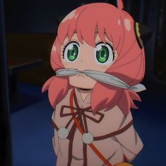 an anime character with pink hair and green eyes holding a scissor in front of her face