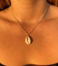 "Cowrie Shell Necklace Options between 14k gold plated and Sterling silver plated 16\" or 18\"" Beach Pendant Jewelry With Clavicle Chain, Dainty Beach Jewelry With Delicate Chain, Sterling Silver Pendant Necklace For Beach, Trendy 16 Inch Jewelry Gift, Sterling Silver Necklace For Summer Gifts, White Metal Necklaces For The Beach, Dainty Clavicle Chain Necklace For Beach, Elegant Silver Necklace For Beach, Silver Summer Chain Necklace With Adjustable Chain