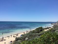 many people are on the beach and in the water at this point, there is no image here to provide a caption for