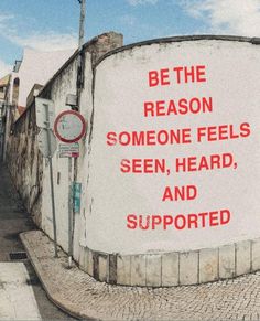 a sign on the side of a building that says be the reason someone feels see, hear and supported