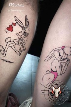 two tattoos on the legs of people