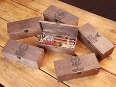 six wooden boxes with cigars in them on a table