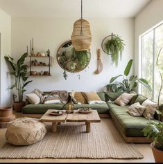 a living room filled with lots of green furniture and plants on the wall above it