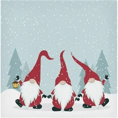 three red and white gnomes in the snow