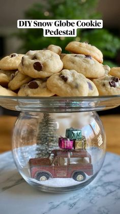 cookies and cookies in a bowl on a table with the words diy snow globe cookie presidential