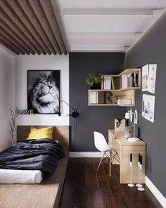 a bedroom with grey walls and wood floors