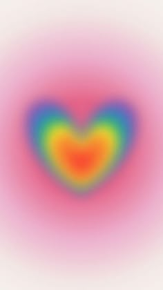 an image of a heart shaped object in the middle of a blurry pink and blue background