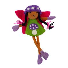 a stuffed toy doll with purple hair and green dress