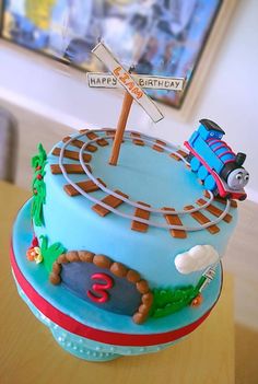 a thomas the train birthday cake on a table