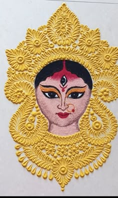 an intricately designed paper with a woman's face on it