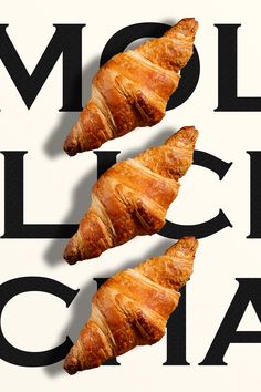 two croissants sitting on top of each other in front of a black and white background