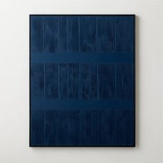 a blue painting on a white wall